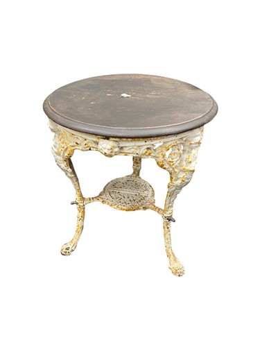 Lot 527 - A white painted cast iron pub table decorated...