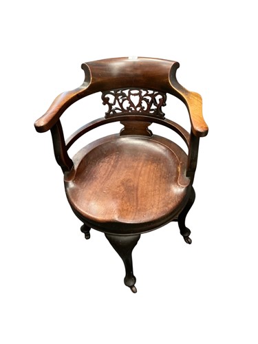 Lot 443 - A late Victorian mahogany swivel top desk...