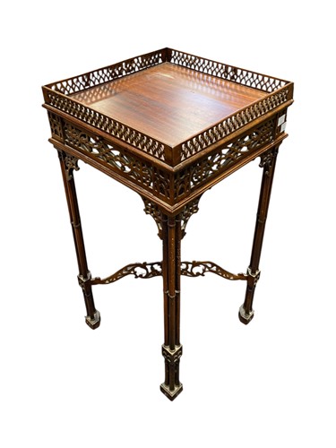 Lot 525 - A Chippendale style mahogany urn stand with...
