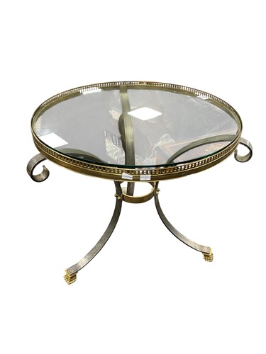 Lot 520 - A brass and glass circular table with pierced...