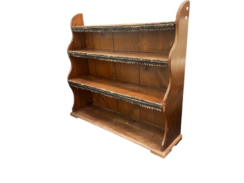 Lot 439 - A 20th century stained pine waterfall bookcase...