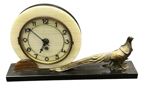 Lot 80 - An Art Deco overmantel clock, the circular...