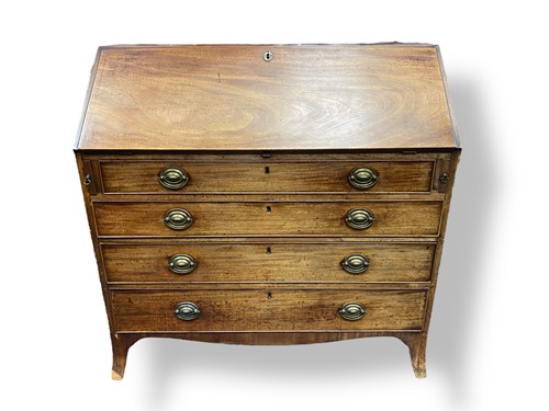 Lot 437 - A Regency mahogany Bureau with four long...
