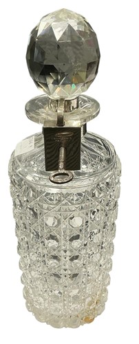 Lot 49 - A cut glass square body decanter with collar...