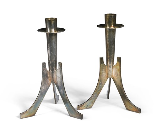 Lot 259 - A pair of white metal candlesticks