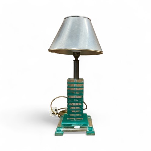 Lot 155 - A lucite table lamp, banded in clear and...