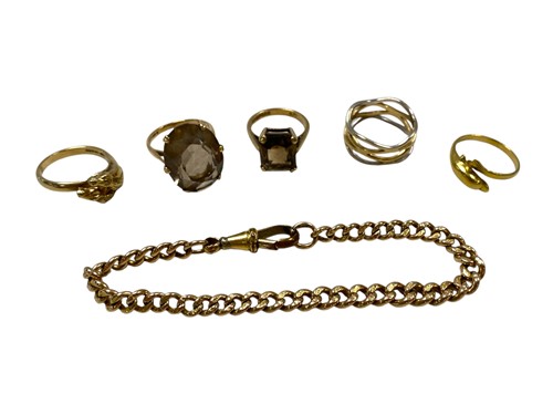 Lot 270 - A dolphin ring stamped '18CT' weight 2.1g,...