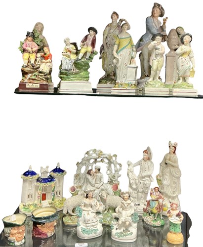 Lot 90 - A large collection of Staffordshire figures...