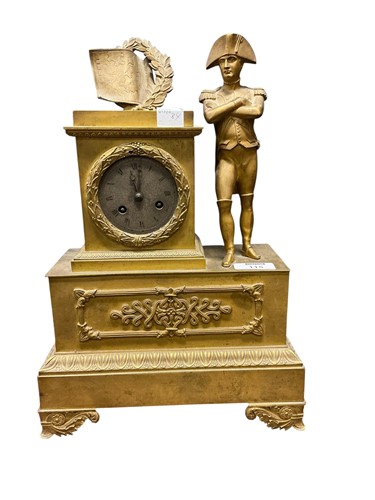 Lot 115 - A French gilt metal mantle clock with Napoleon...