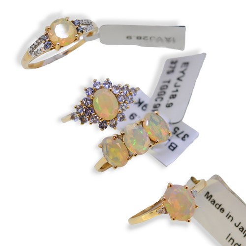Lot 74 - Four 9ct gold opal Gemporia rings, together with a pair of opal earrings
