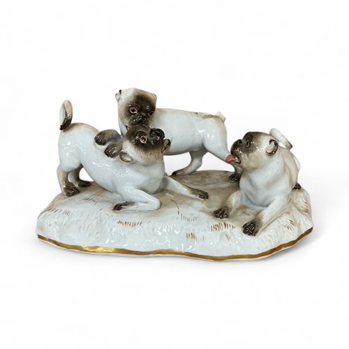 Lot 41 - A Meissen porcelain pug group, 20th century,...
