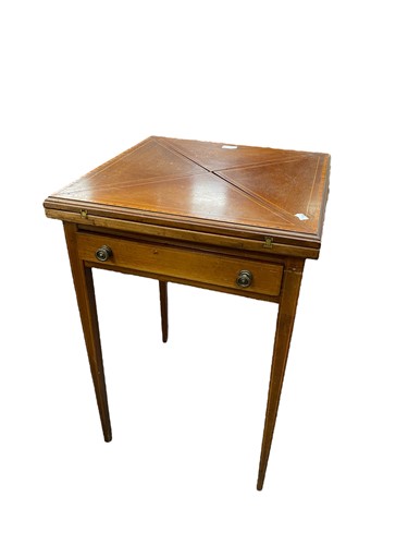Lot 546 - An Edwardian mahogany envelope card table, 75...