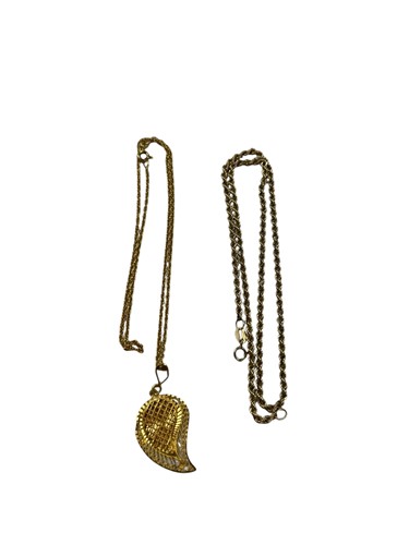 Lot 303 - A filigree style pendant, tested as 22ct gold...