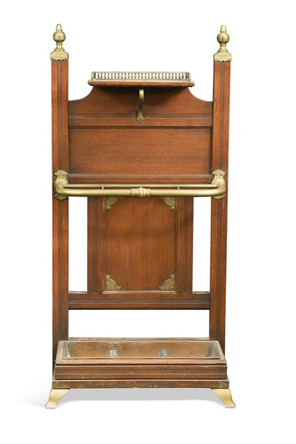 Lot 333 - Attributed to James Shoolbred & Co., an oak and brass stick stand