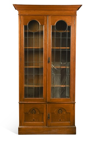 Lot 365 - An English Arts & Crafts inlaid oak bookcase, circa 1900