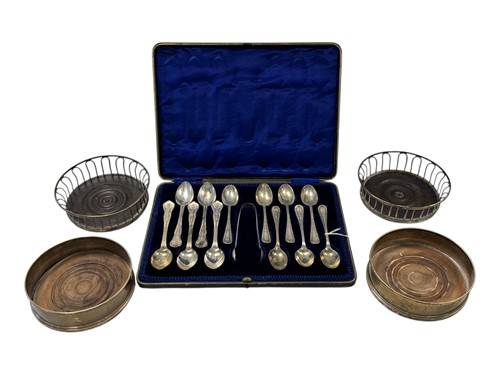 Lot 275 - A pair of silver bottle coasters, together...