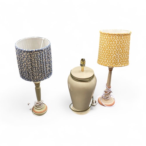 Lot 110 - A collection of lamps to include two wooden...