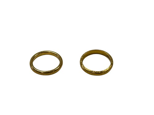 Lot 301 - Two hallmarked 22ct gold wedding bands, gross...