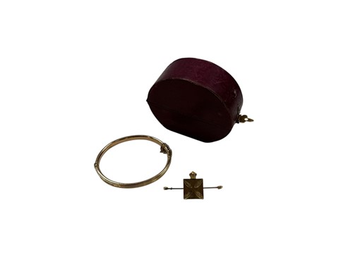 Lot 302 - A cased bangle stamped '9CT' weight 7.4g,...