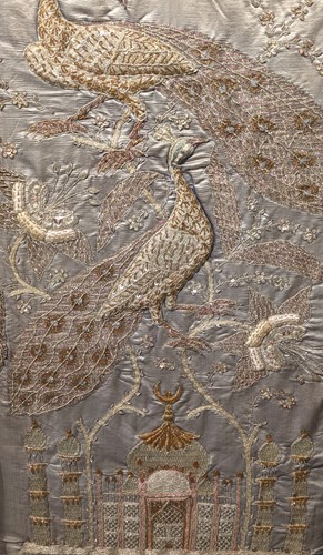 Lot 397 - Indian silkwork panel with peacocks and the...