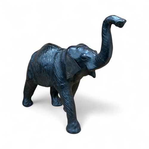 Lot 152 - A leather model of an elephant, inset with...