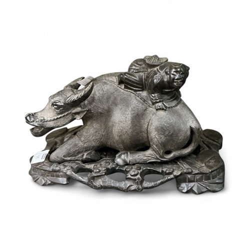 Lot 11 - A Chinese carved hardwood model of a buffalo...