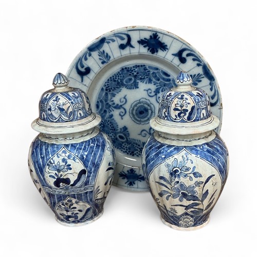 Lot 4 - A group of Delft, to include two lidded vases...