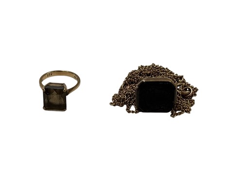 Lot 300 - A smoky quartz fob seal and chain, tested as...