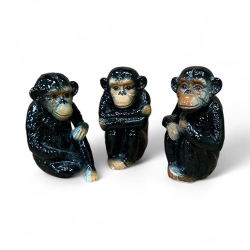 Lot 23 - Three porcelain figures of chimpanzees,...
