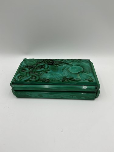 Lot 125 - An Art Deco carved malachite glass cigarette...