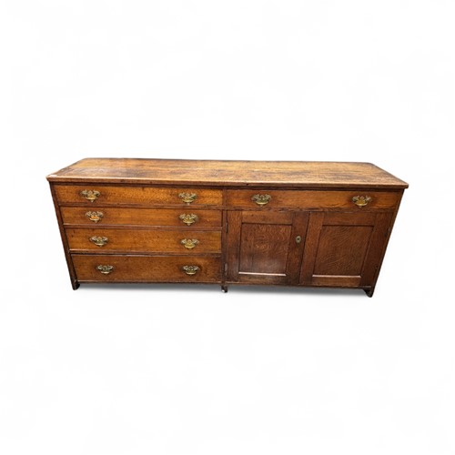 Lot 566 - An oak kitchen dresser, early 20th century,...