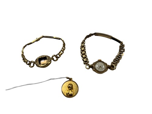 Lot 313 - A pendant tested as 18ct gold, together with a...