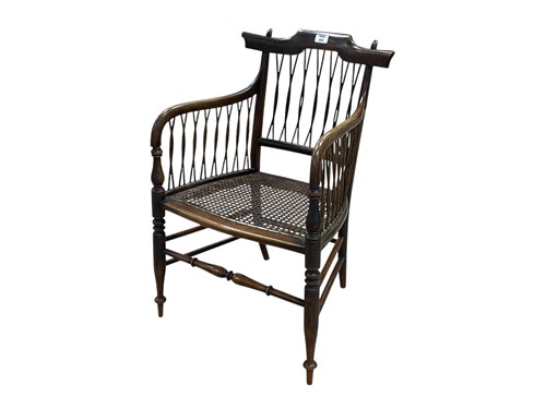 Lot 600 - A stained wood armchair with caned seat, circa...