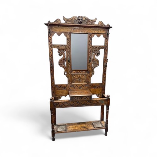 Lot 500 - A early 20th century oak hall stand with...