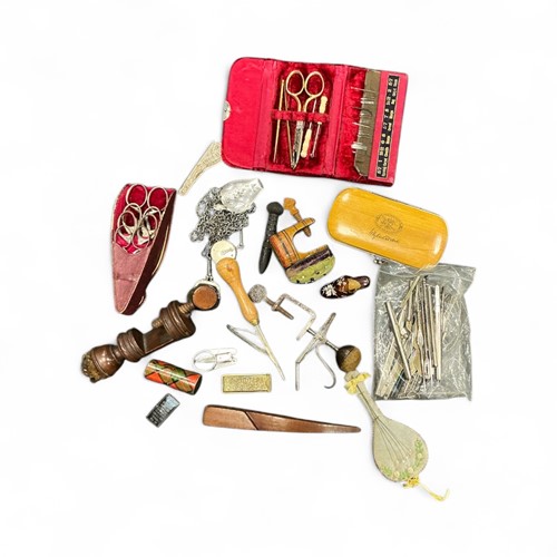 Lot 132 - A collection of sewing accessories to include,...