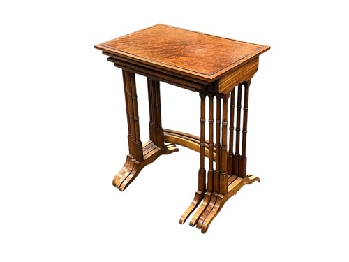 Lot 630 - An amboyna nest of four tables, late 19th...