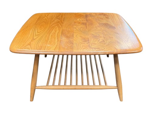 Lot 503 - An Ercol elm coffee table with stick...