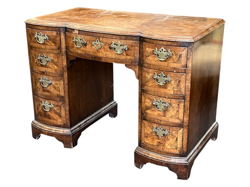 Lot 626 - A 1930's Queen Anne style walnut kneehole desk,...