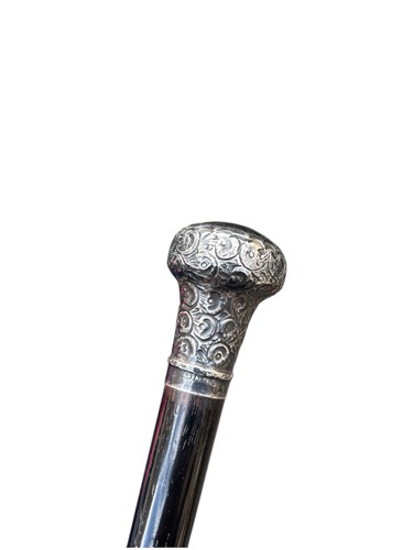 Lot 285 - Ebonised swagger stick, with repousse silver...