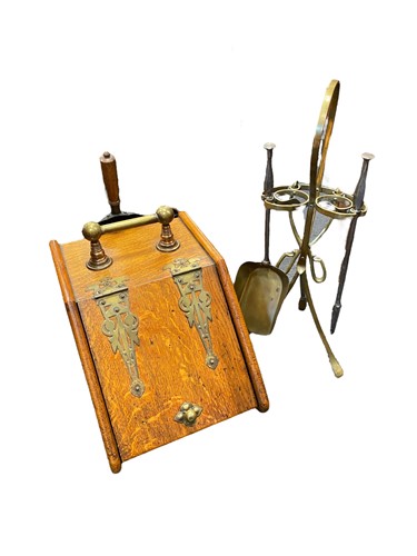 Lot 527 - An Arts and Crafts oak coal scuttle with large...