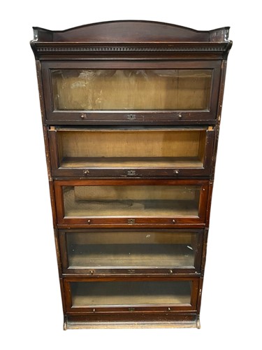 Lot 514 - A early 20th century five tier glazed...