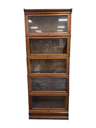 Lot 550 - A large early 20th Century oak five tier...