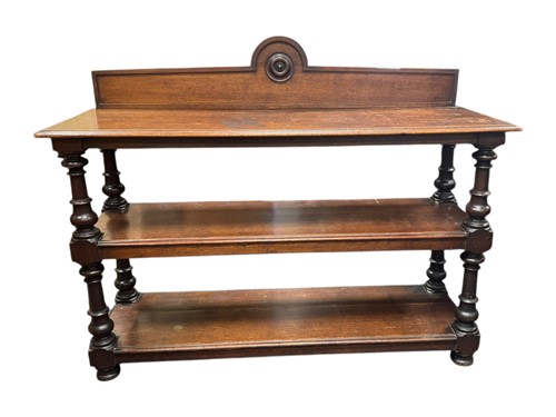 Lot 596 - A late Victorian three tier oak serving table...