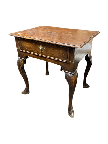 Lot 529 - An 18th century oak lowboy with single frieze...