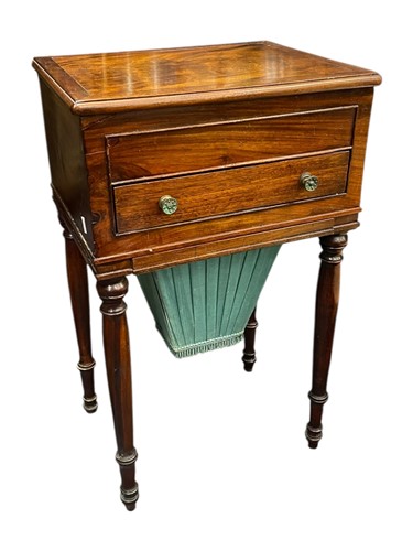 Lot 585 - A 19th century mahogany work table with...