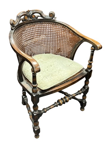 Lot 522 - A stained beech Carolean style tub chair with...