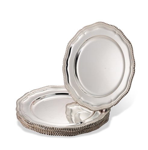 Lot A set of eight Elizabeth II silver dinner plates