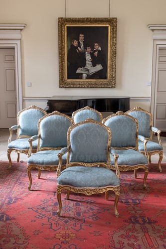 Lot A suite of six French Louis XV gilt frame armchairs, 18th century