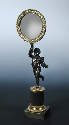 Lot 745 - An early 19th century bronze and ormolu figural mirror