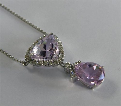 Lot 248 - A kunzite and diamond pendant